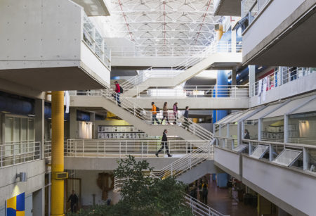 An interior shot showing the stairs and walkways crossing the Art + Architecture Building's atrium